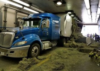 Truck Loaded With Hay Gets Stuck In A Tunnel