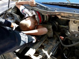 Migrants Hiding Underneath A Car's Bonnet And Seats