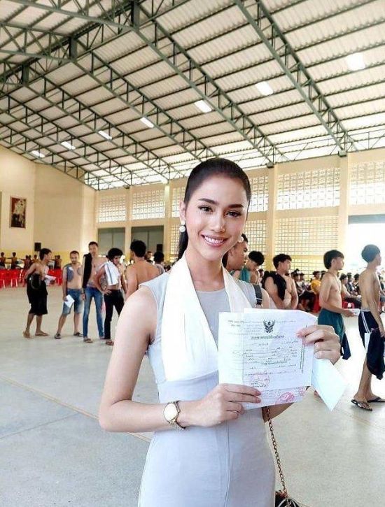 Thai Ladyboys Pose With Certificates That Exempt Them From Army Service
