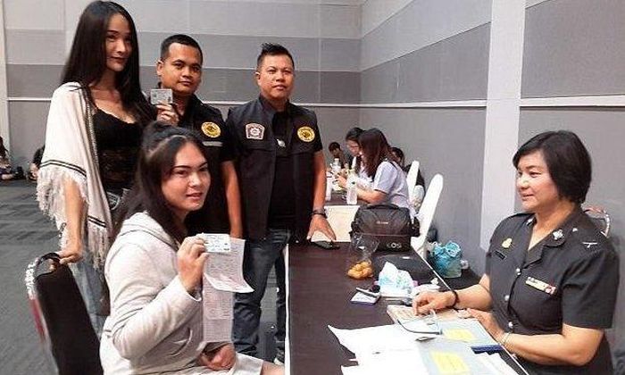 Thai Ladyboys Pose With Certificates That Exempt Them From Army Service
