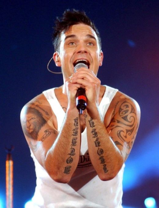Robbie Williams Has Tattoo Of His Own Face On His Torso