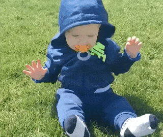 Babies And Grass Is A Funny Combination