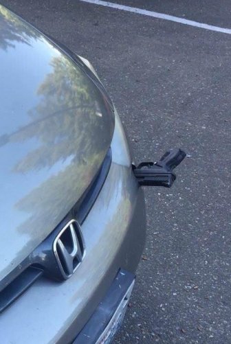 Flying Gun Hits A Car On I-5