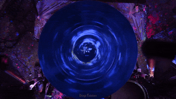 A Hypnotizing Potter’s Wheel Under Ultraviolet Light