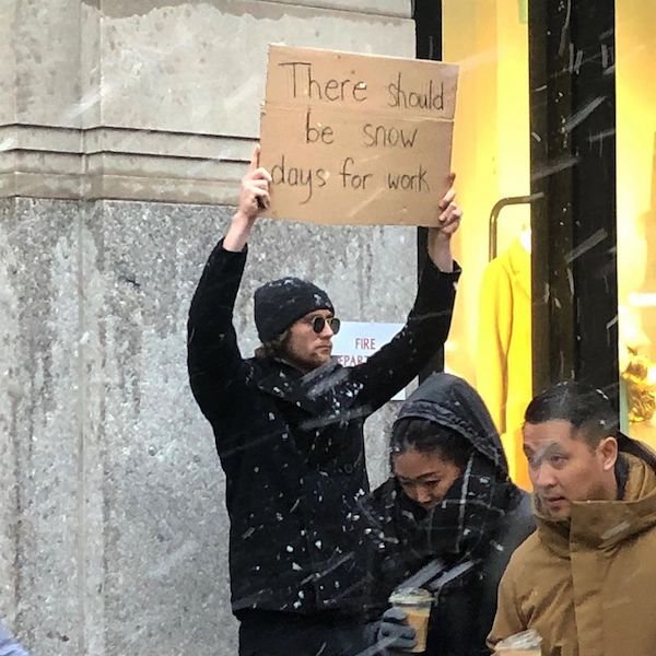 Guy With A Sign Shows Off Funny Statements