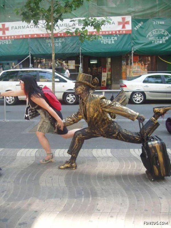 People Having Fun With Sculptures